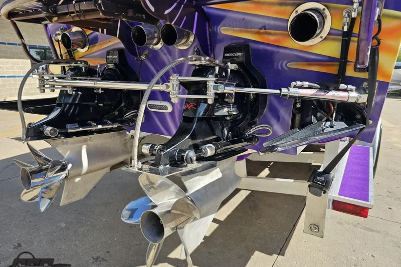 Slide: The Image of Rear view of a 2002 Cigarette 42' Tiger boat with dual Mercury engines. - 37