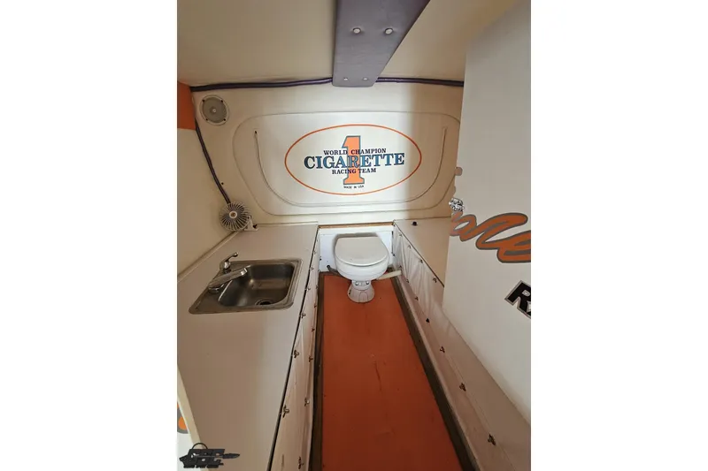 Slide: The Image of Interior of 2002 Cigarette 42' Tiger boat featuring sink and toilet. - 82