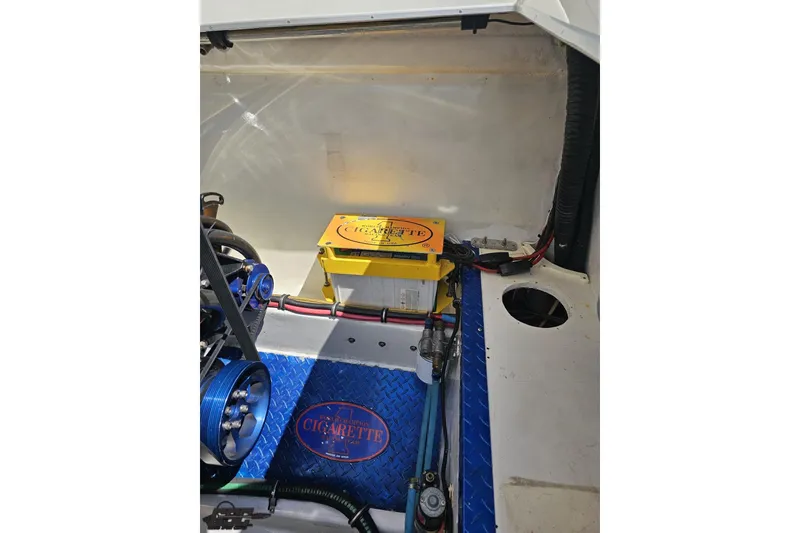 Slide: The Image of Engine compartment of a 2002 Cigarette 42' Tiger boat with visible components. - 98