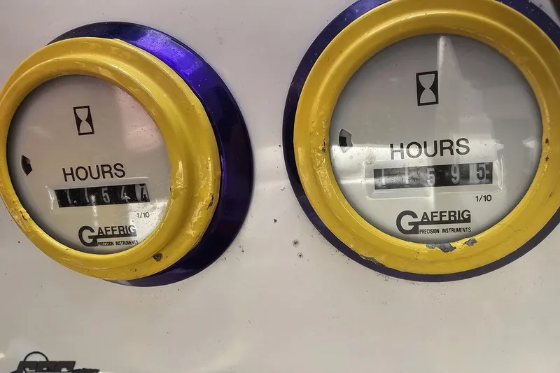 Slide: The Image of Hour meters on a 2002 Cigarette 42' Tiger boat, showing usage hours. - 102