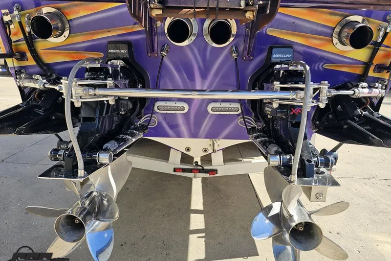 Slide: The Image of Rear view of a 2002 Cigarette 42' Tiger boat with Mercury engines. - 35