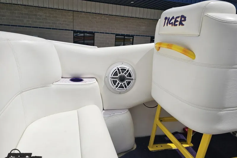 Slide: The Image of Interior of a 2002 Cigarette 42' Tiger boat with white seating and speaker. - 59