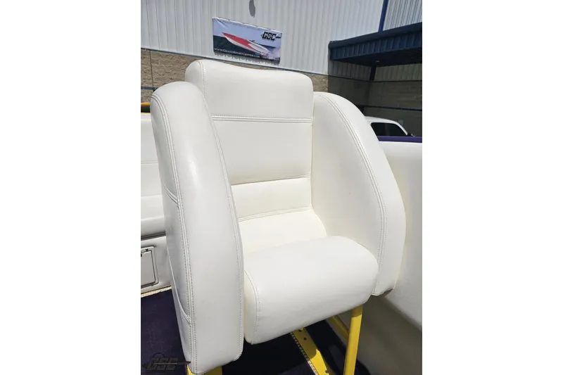Slide: The Image of White leather seat on a 2002 Cigarette 42' Tiger boat, outdoor setting. - 88
