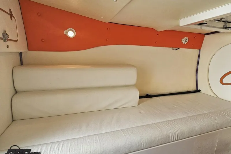 Slide: The Image of Interior cabin of a 2002 Cigarette 42' Tiger boat with white and orange accents. - 77