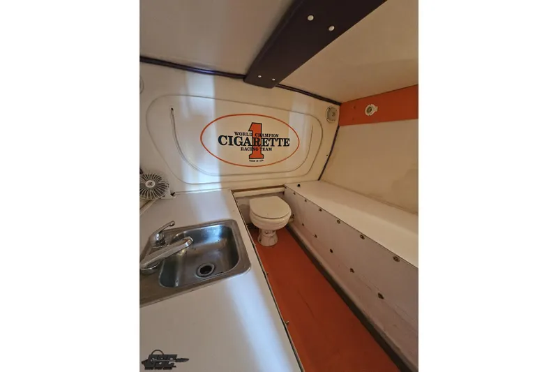 Slide: The Image of Interior of 2002 Cigarette 42' Tiger boat with sink, toilet, and bench seating. - 83