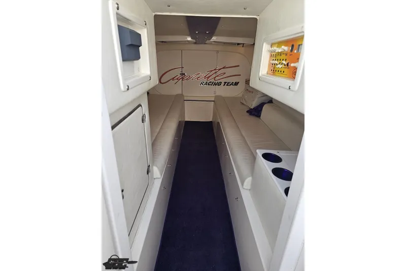 Slide: The Image of Interior of 2002 Cigarette 42' Tiger boat with seating and storage compartments. - 73