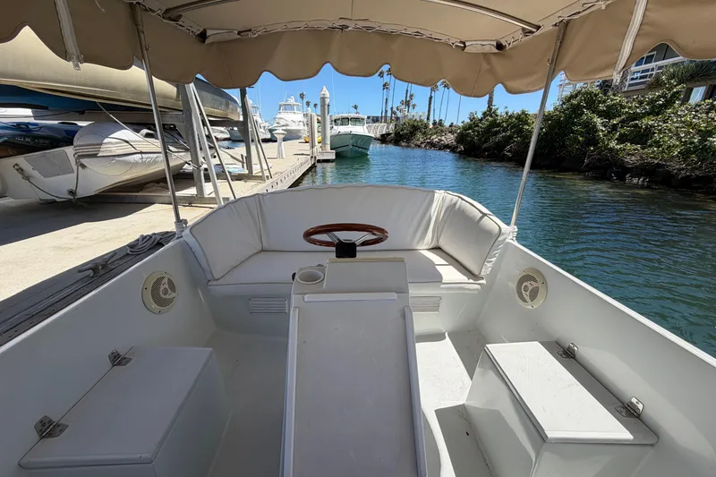Slide: The Image of Interior view of a 1996 Duffy 16 boat docked at a marina. - 10