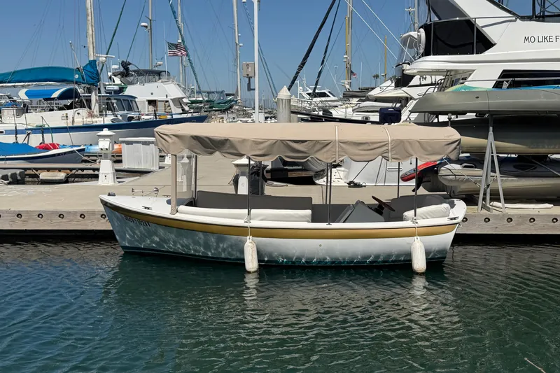 The Image of 1996 Duffy 16 boat docked at marina with canopy and fenders. - 0