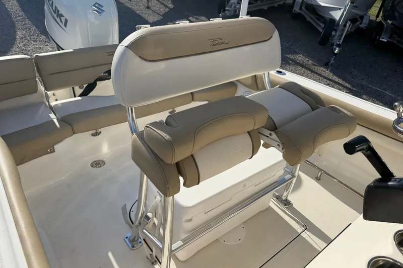 Slide: The Image of 2021 Pioneer 202 Islander boat interior with beige seating and Suzuki engine. - 47