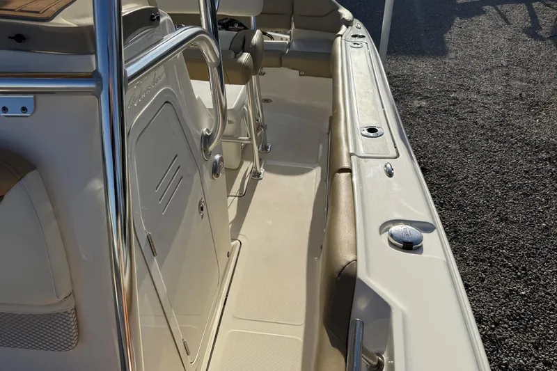 Slide: The Image of 2021 Pioneer 202 Islander boat interior with seating and stainless steel railings. - 43