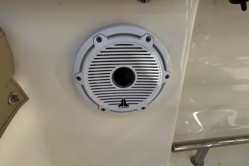 Slide: The Image of White JL Audio speaker on 2021 Pioneer 202 Islander boat interior. - 50