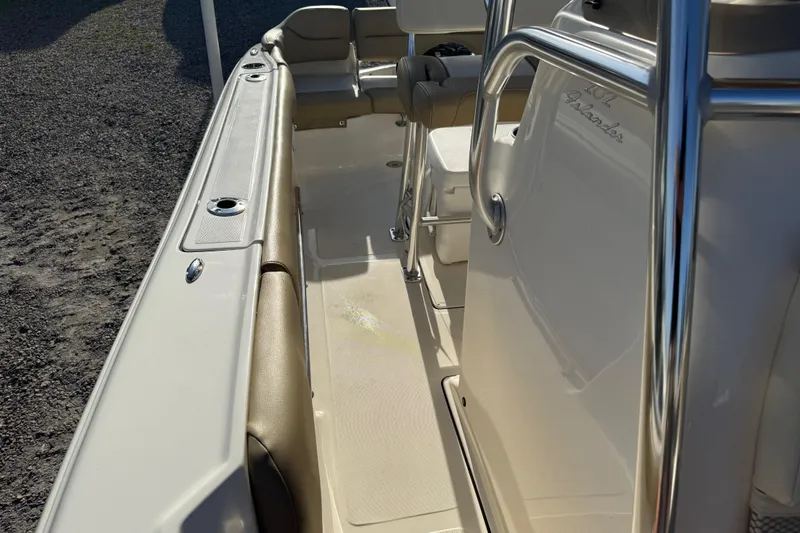 Slide: The Image of 2021 Pioneer 202 Islander boat interior with seating and stainless steel railings. - 44