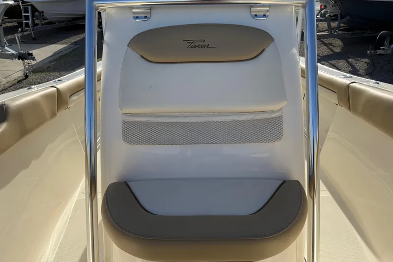 Slide: The Image of 2021 Pioneer 202 Islander boat interior with cushioned seating and stainless steel frame. - 41