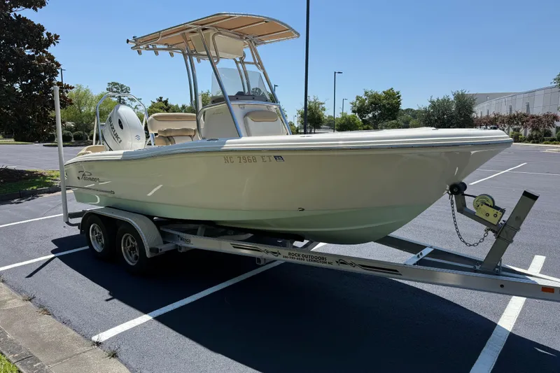 Slide: The Image of 2021 Pioneer 202 Islander boat on trailer in parking lot, sunny day. - 33