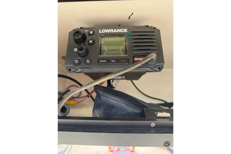 Slide: The Image of Lowrance marine radio on 2021 Pioneer 202 Islander boat dashboard. - 56