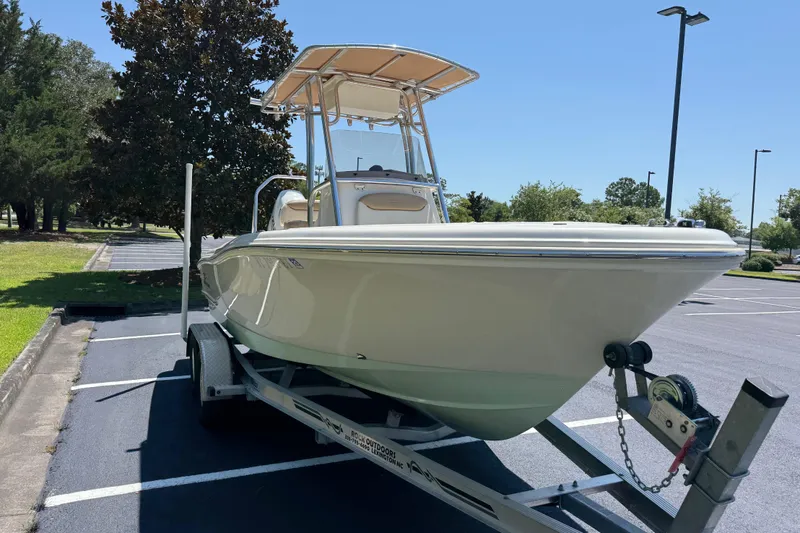 Slide: The Image of 2021 Pioneer 202 Islander boat on trailer in sunny parking lot. - 34