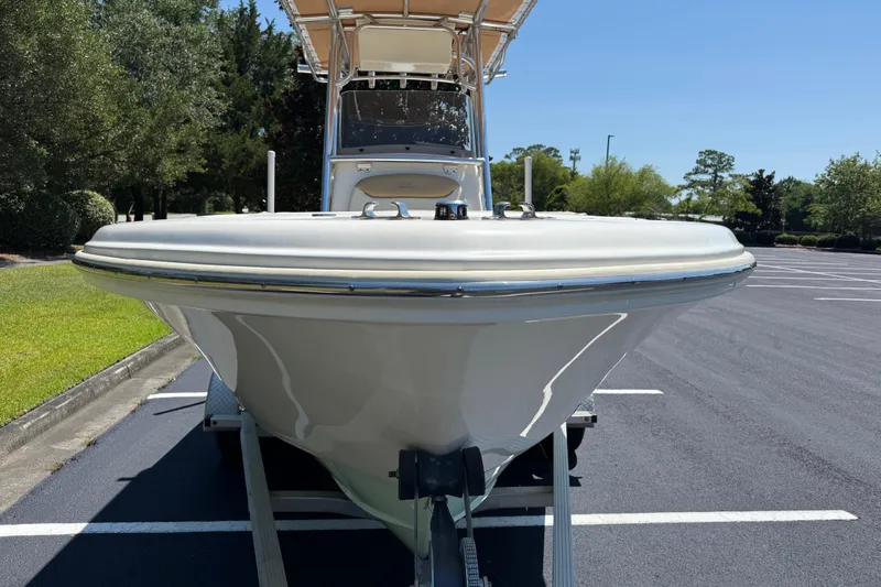 Slide: The Image of 2021 Pioneer 202 Islander boat on trailer in parking lot, front view. - 35