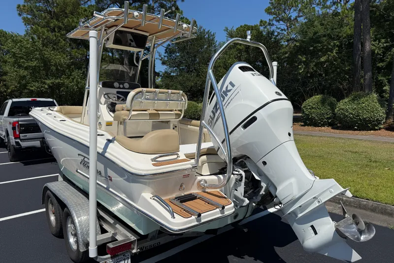 Slide: The Image of 2021 Pioneer 202 Islander boat on trailer with Suzuki outboard motor. - 28