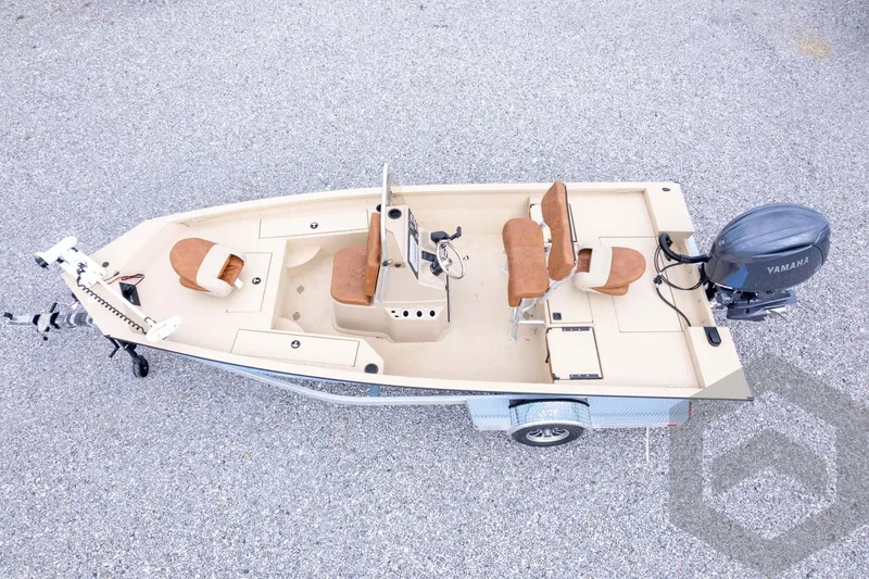Slide: The Image of 2026 G3 Bay 19 GX boat with Yamaha motor, beige interior, and trailer on gravel. - 35