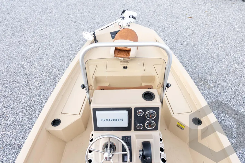 Slide: The Image of 2026 G3 Bay 19 GX boat dashboard with Garmin navigation system and steering wheel. - 16