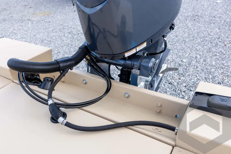 Slide: The Image of 2026 G3 Bay 19 GX boat engine detail with cables on a gravel surface. - 31