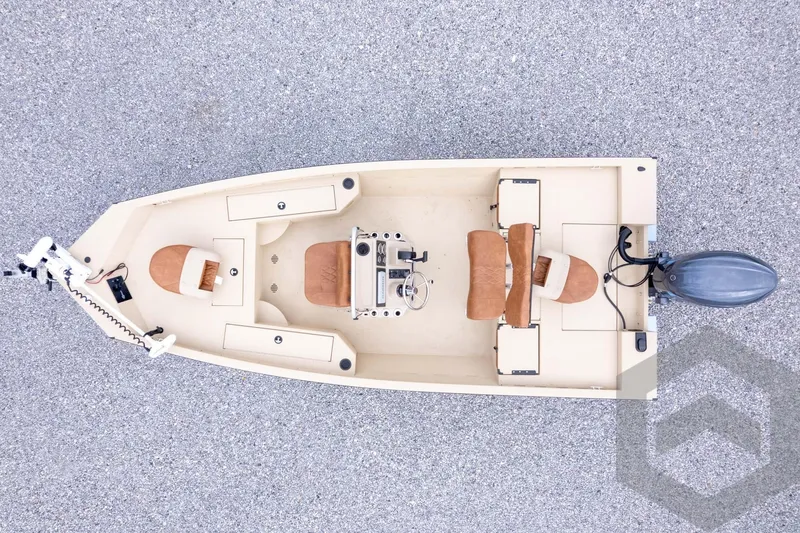 Slide: The Image of 2026 G3 Bay 19 GX boat, aerial view, featuring seating and motor on a textured surface. - 32