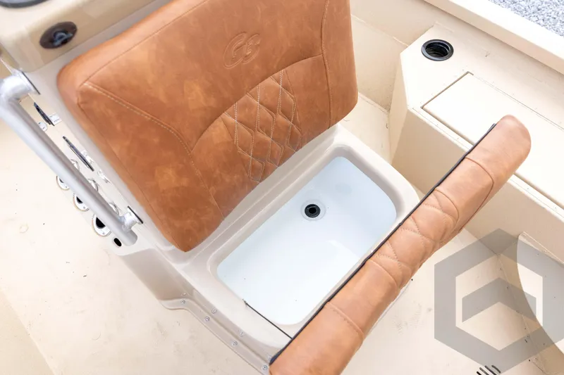Slide: The Image of 2026 G3 Bay 19 GX boat seat with storage compartment, featuring tan leather upholstery. - 21