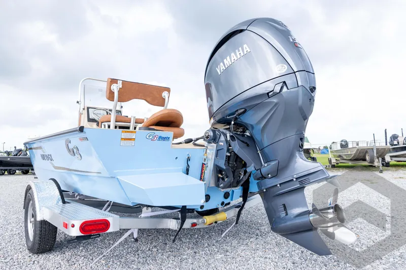 Slide: The Image of 2026 G3 Bay 19 GX boat with Yamaha outboard motor on a trailer. - 12