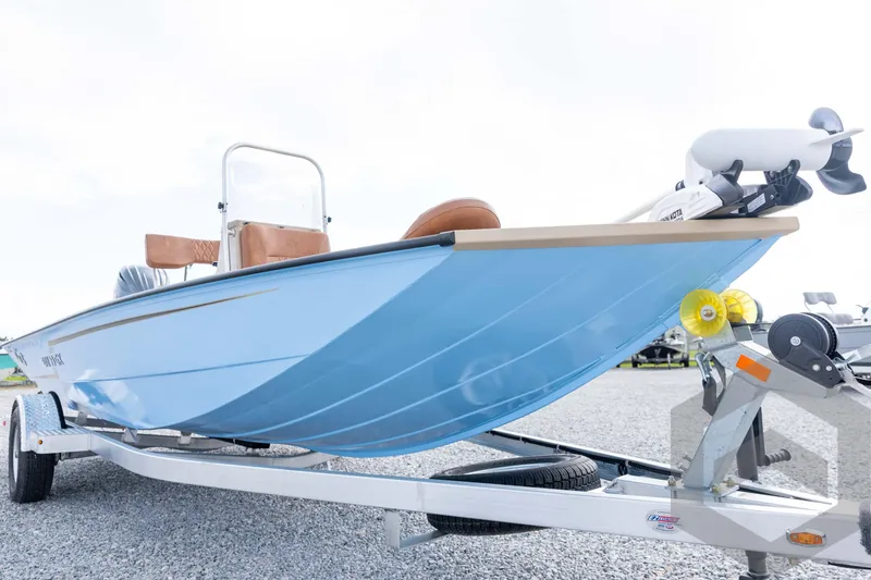 Slide: The Image of 2026 G3 Bay 19 GX boat on trailer, featuring sleek blue design and modern equipment. - 8