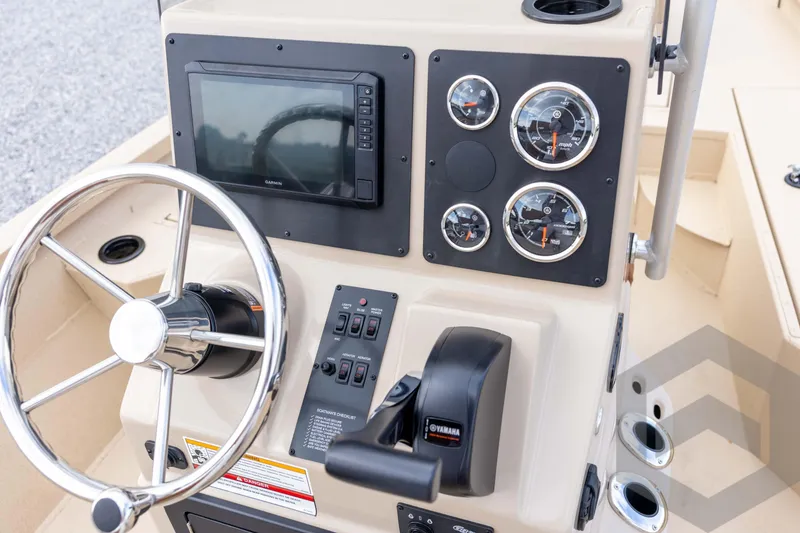 Slide: The Image of Steering console of 2026 G3 Bay 19 GX boat with gauges and controls. - 25