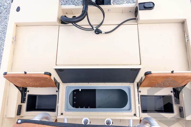 Slide: The Image of G3 Bay 19 GX 2026 boat interior with storage compartments and control panel. - 29