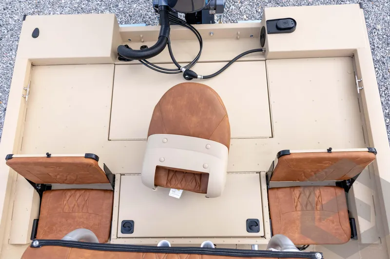 Slide: The Image of 2026 G3 Bay 19 GX boat interior with brown leather seats and beige deck. - 27