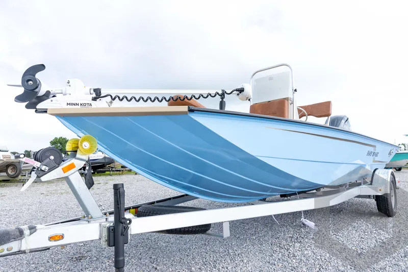 Slide: The Image of 2026 G3 Bay 19 GX boat on trailer with Minn Kota trolling motor. - 13
