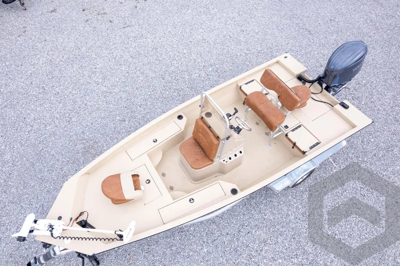Slide: The Image of 2026 G3 Bay 19 GX boat with tan seating and outboard motor on trailer. - 36