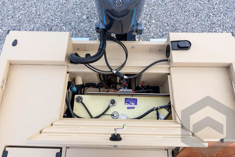 Slide: The Image of 2026 G3 Bay 19 GX boat engine compartment with visible wiring and components. - 30