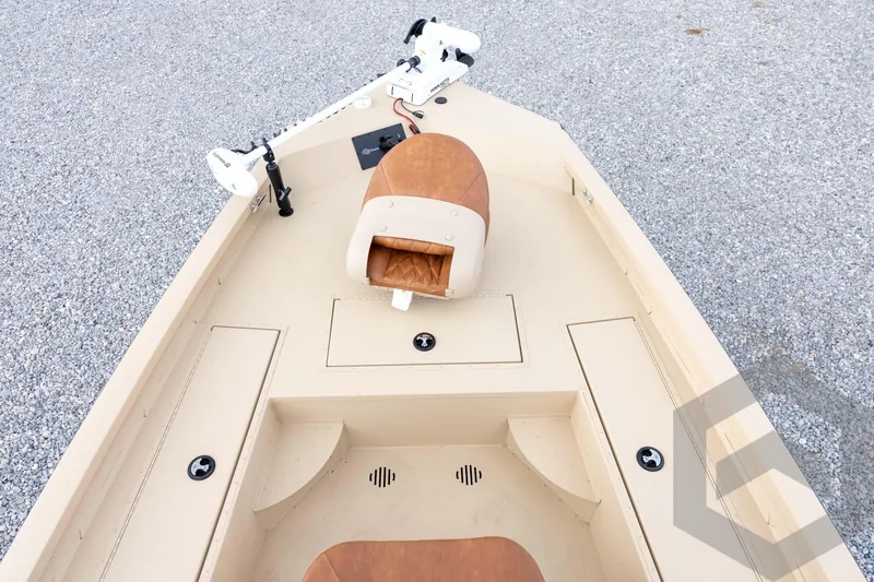 Slide: The Image of 2026 G3 Bay 19 GX boat interior with tan seating and storage compartments. - 17