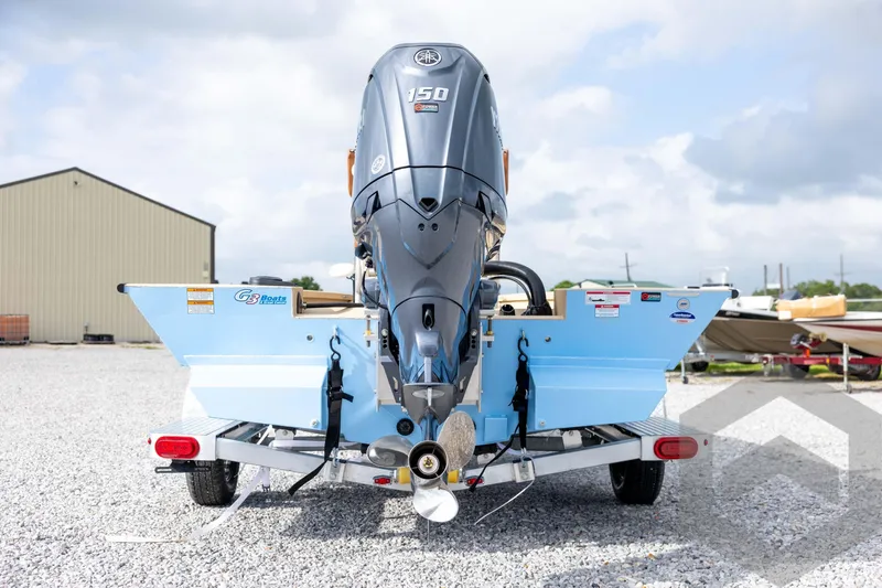 Slide: The Image of 2026 G3 Bay 19 GX boat with powerful outboard motor on trailer. - 5