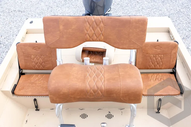 Slide: The Image of 2026 G3 Bay 19 GX boat with brown leather seating and sleek design. - 28