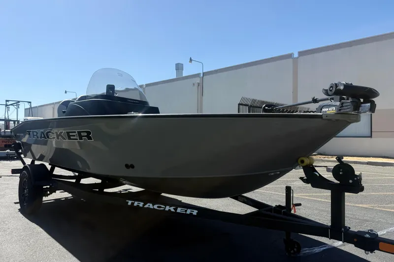 Slide: The Image of 2027 Tracker Pro Guide V-16 SC boat on trailer, parked outdoors. - 3