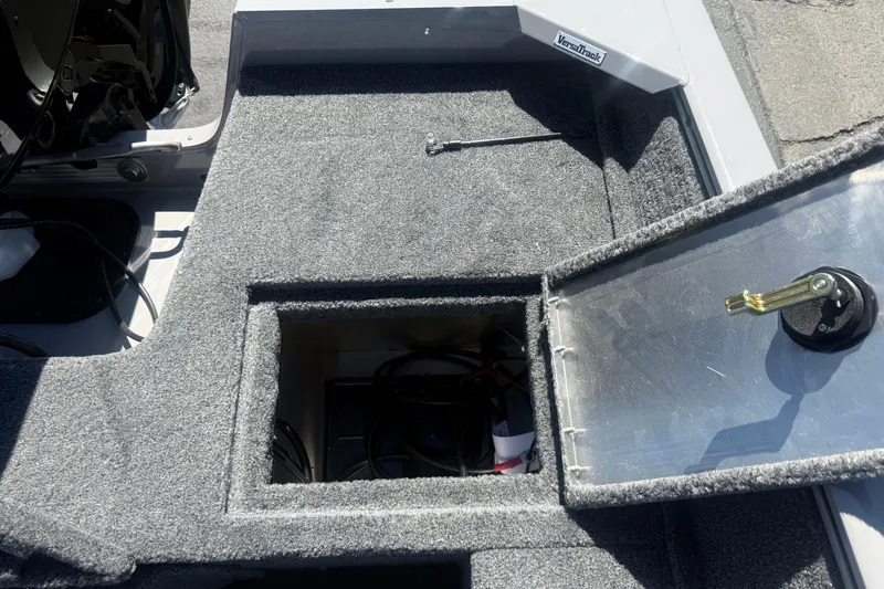 Slide: The Image of Interior view of 2027 Tracker Pro Guide V-16 SC boat storage compartment with open hatch. - 9