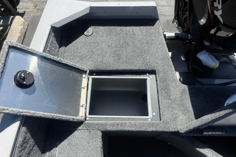 Slide: The Image of Open storage compartment on 2027 Tracker Pro Guide V-16 SC boat deck. - 8