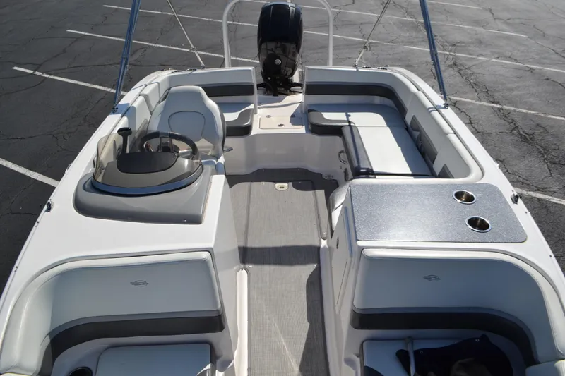 Slide: The Image of 2018 Chaparral 191 Suncoast boat interior with seating and steering console. - 10
