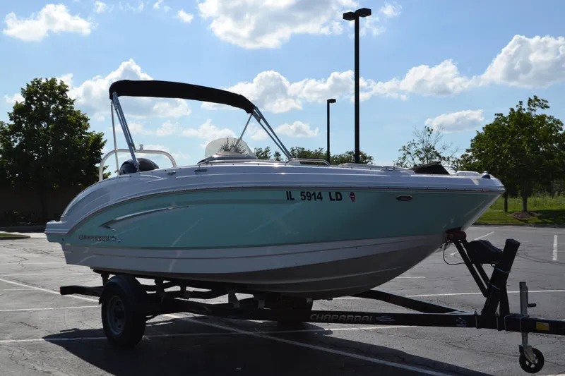 Slide: The Image of 2018 Chaparral 191 Suncoast boat on trailer in sunny parking lot. - 2