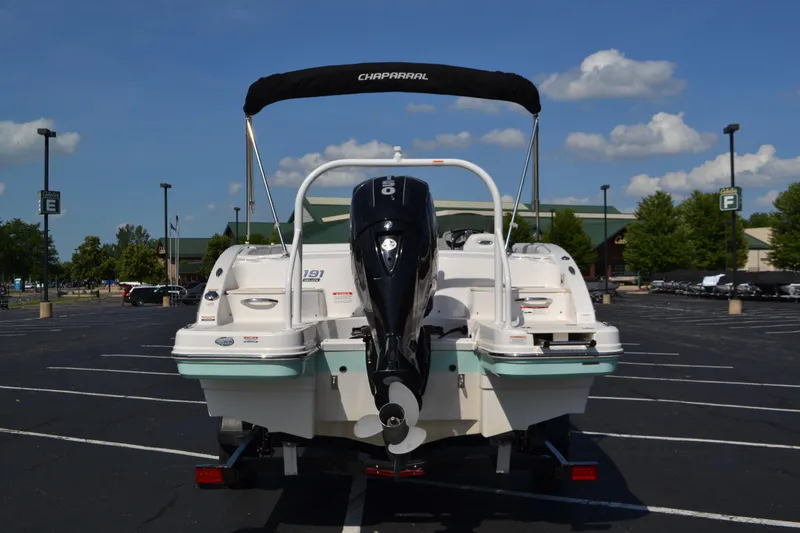 Slide: The Image of 2018 Chaparral 191 Suncoast boat with outboard motor in parking lot. - 5