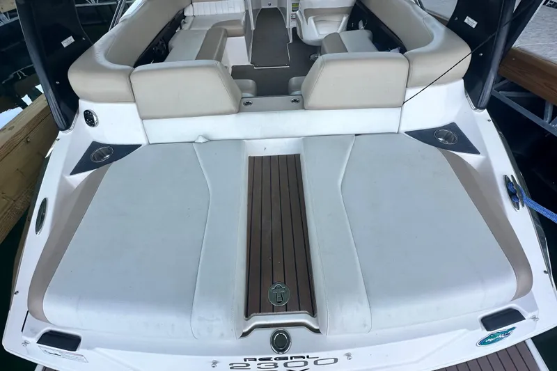 Slide: The Image of 2012 Regal 2300 RX Bowrider boat with spacious seating and sleek design. - 8