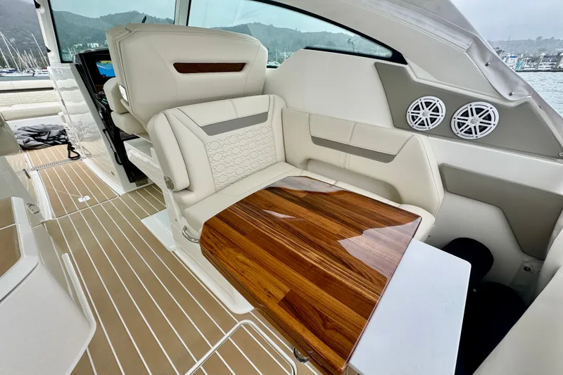 Slide: The Image of Luxurious interior of 2027 Tiara Yachts 34 LX with elegant seating and wooden table. - 18