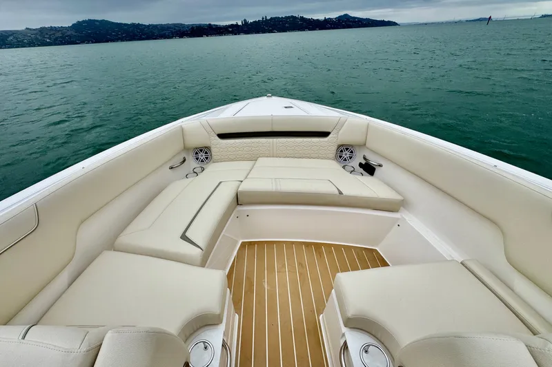 Slide: The Image of Luxurious seating on 2027 Tiara Yachts 34 LX, overlooking serene waters. - 33