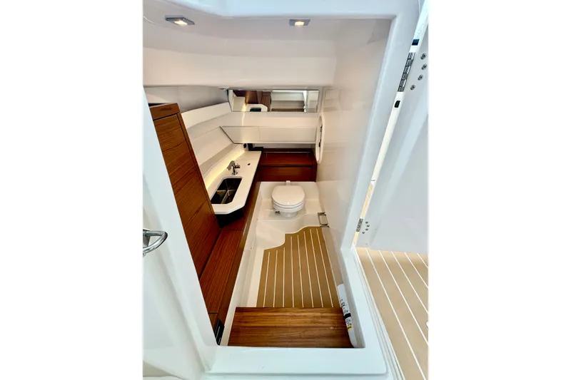 Slide: The Image of Luxurious bathroom interior of 2027 Tiara Yachts 34 LX, featuring modern fixtures and wood accents. - 39