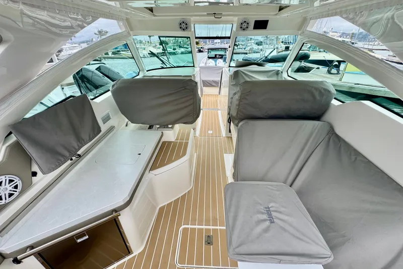 Slide: The Image of Interior of 2027 Tiara Yachts 34 LX, featuring sleek seating and modern design. - 14