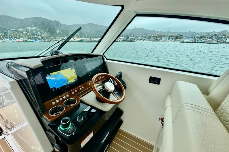 Slide: The Image of Interior view of 2027 Tiara Yachts 34 LX helm with advanced navigation system. - 22